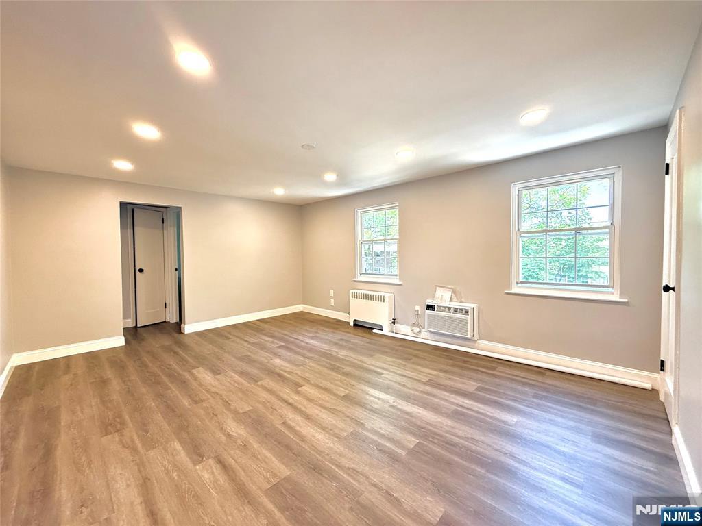 20 Clark Court Rutherford, NJ 07070 - Photo 10 of 29 a view of an empty room with wooden floor and a window