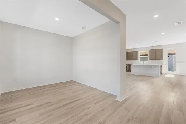a view of kitchen and wooden floor