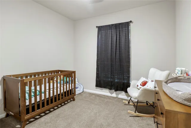 a bedroom with furniture and a window