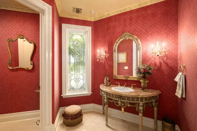 a living room with fireplace furniture and a chandelier