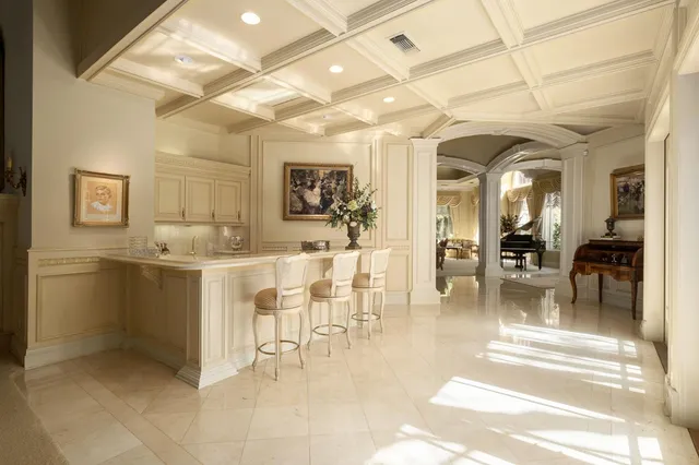 a view of a a dining room with furniture window and outside view