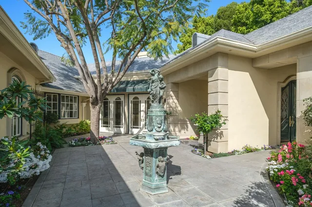 a kitchen with stainless steel appliances kitchen island granite countertop a sink and cabinets
