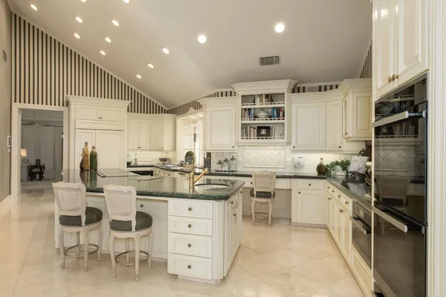 a bed room with a bed and a large window