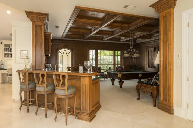 a large bathroom with a large mirror vanity and shower