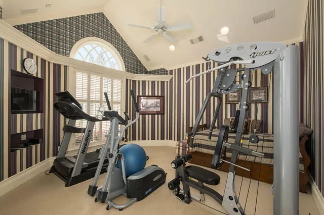 a bathroom with double vanity sink a mirror and a shower