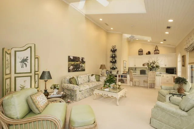 a living room with furniture and a bookshelf