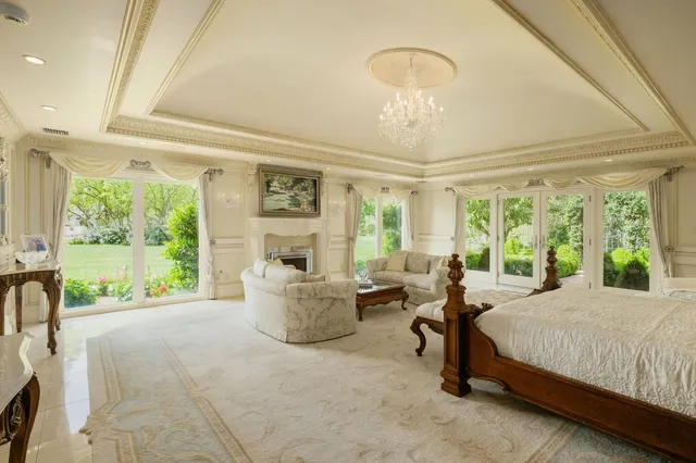 a view of a patio with table and chairs potted plants