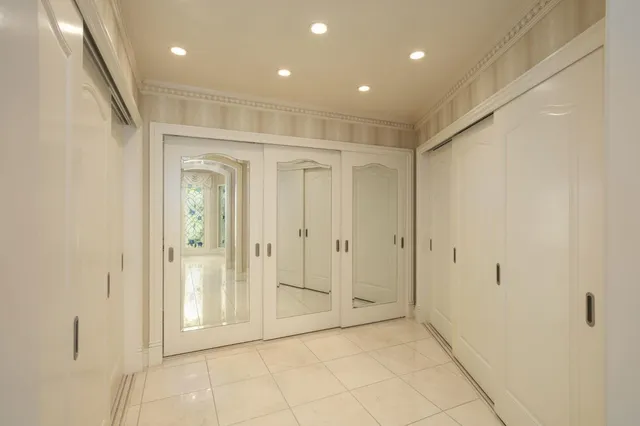 a view of a park with large trees and plants