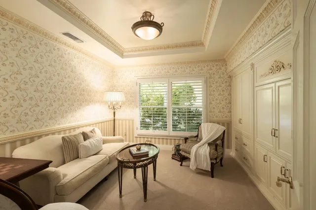 an aerial view of residential houses with outdoor space and trees all around