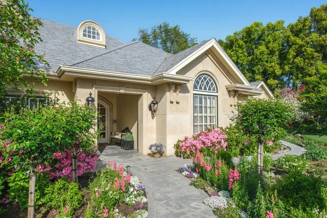 a view of a house with a small yard
