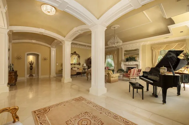 a lobby with furniture and a large window