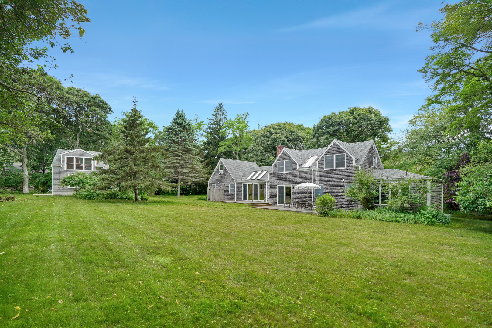 174 Middle Road Chilmark, MA 02535 - Photo 1 of 40 a view of a house with a big yard