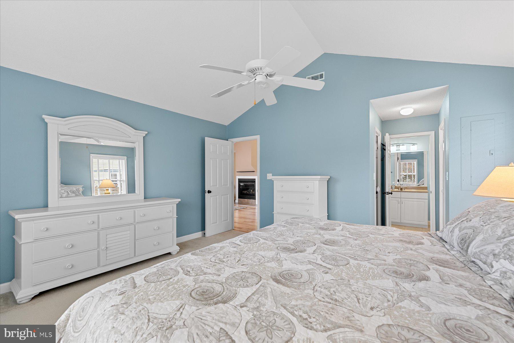 11 Amanda's Court Ocean View, DE 19970 - Photo 29 of 42 a bedroom with a large bed and a chandelier