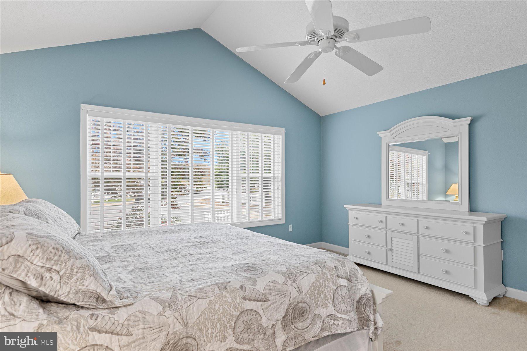 11 Amanda's Court Ocean View, DE 19970 - Photo 30 of 42 a bedroom with a large bed and a chandelier fan