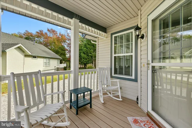 a view of a two chairs in the balcony