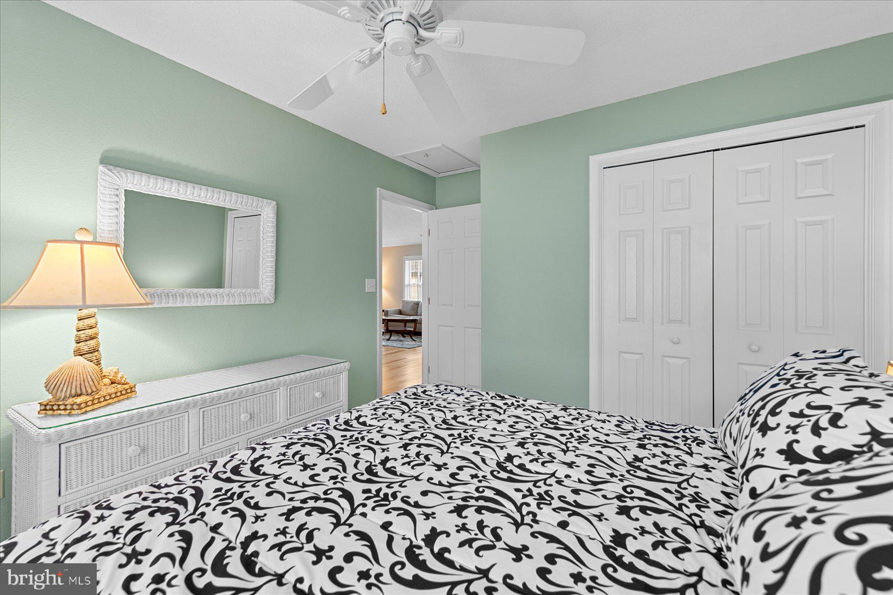 11 Amanda's Court Ocean View, DE 19970 - Photo 33 of 42 a bedroom with a bed and a lamp