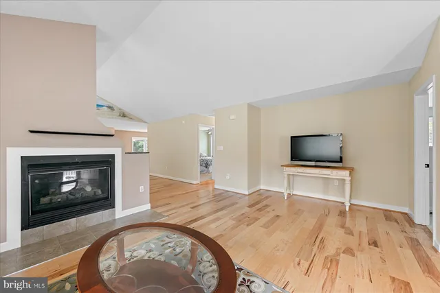 a bedroom with a bed and a television