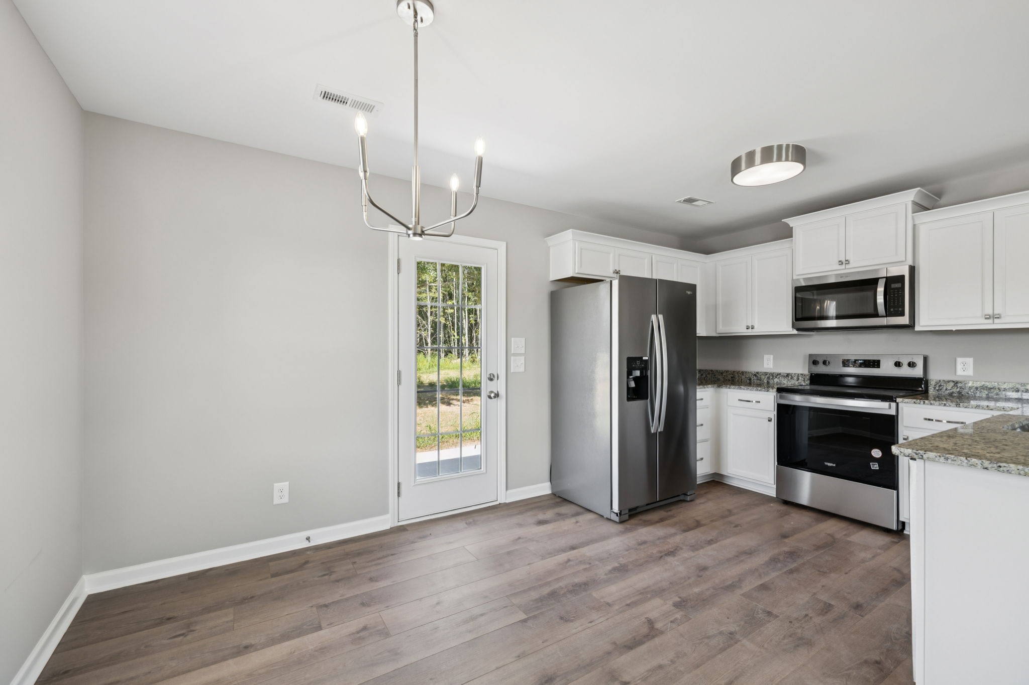 84 Old Brick Church Road Estill Springs, TN 37330 - Photo 11 of 37 a kitchen with stainless steel appliances a refrigerator sink and microwave