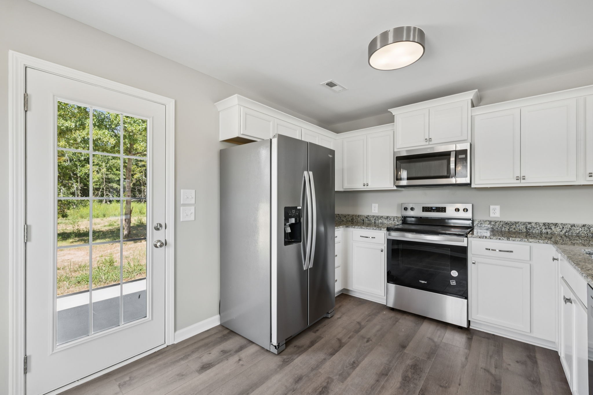84 Old Brick Church Road Estill Springs, TN 37330 - Photo 13 of 37 a kitchen with stainless steel appliances granite countertop a refrigerator stove and sink