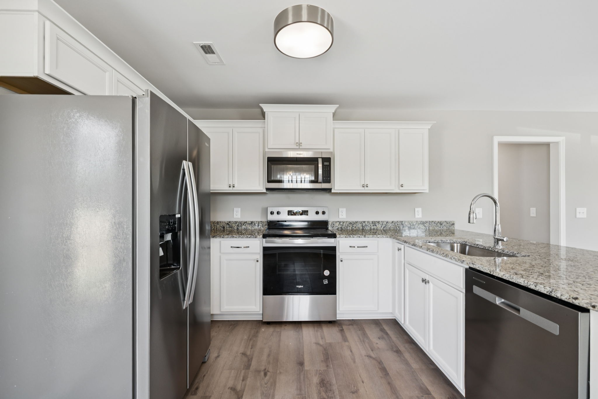 84 Old Brick Church Road Estill Springs, TN 37330 - Photo 14 of 37 a kitchen with stainless steel appliances granite countertop a stove and a refrigerator