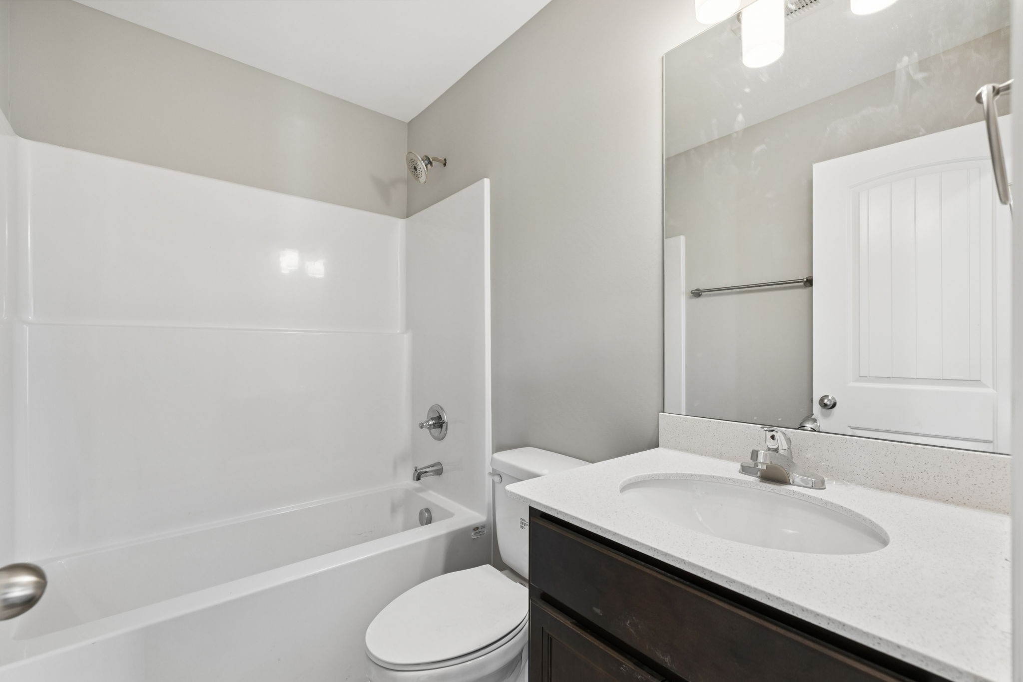 84 Old Brick Church Road Estill Springs, TN 37330 - Photo 20 of 37 a bathroom with a granite countertop sink toilet and shower