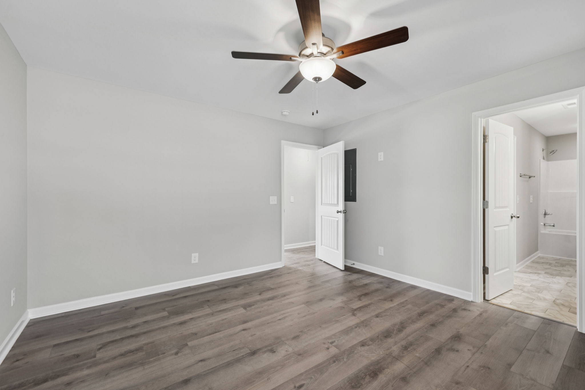 84 Old Brick Church Road Estill Springs, TN 37330 - Photo 27 of 37 an empty room with wooden floor fan and windows