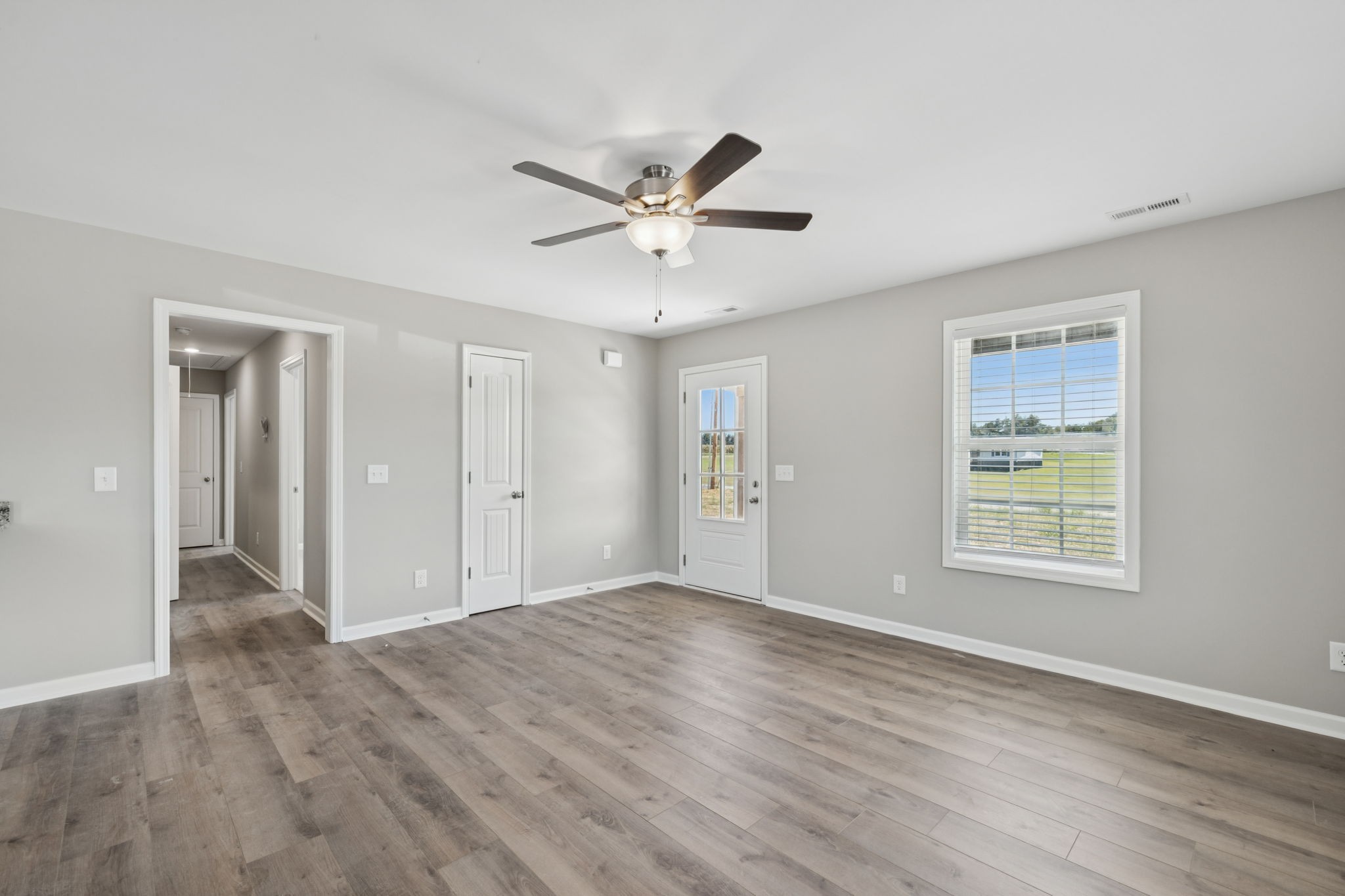 84 Old Brick Church Road Estill Springs, TN 37330 - Photo 10 of 37 a view of an empty room with a window and a ceiling fan