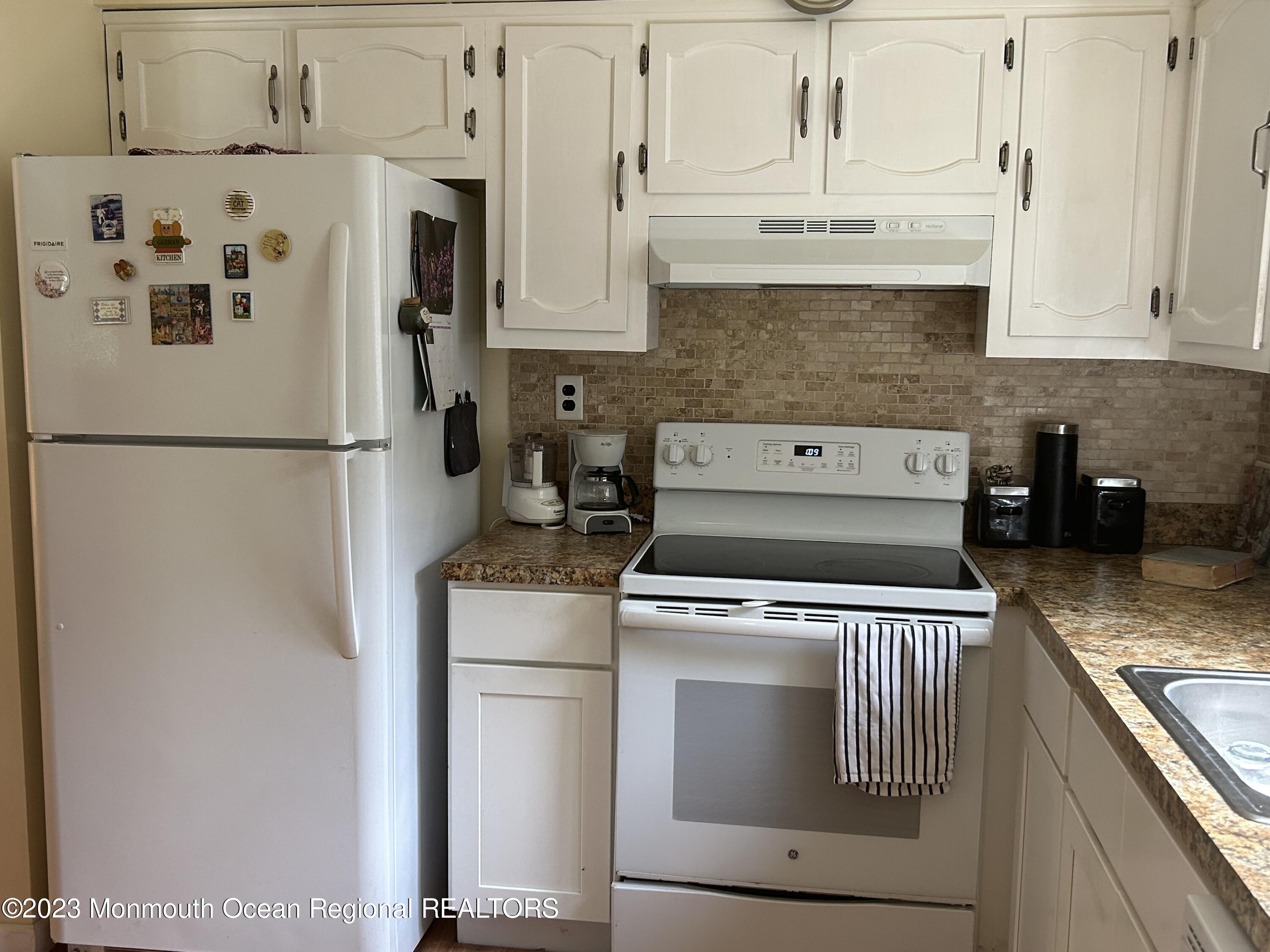 51 Markham Road Brick, NJ 08724 - Photo 14 of 31 a white refrigerator freezer sitting inside of a kitchen