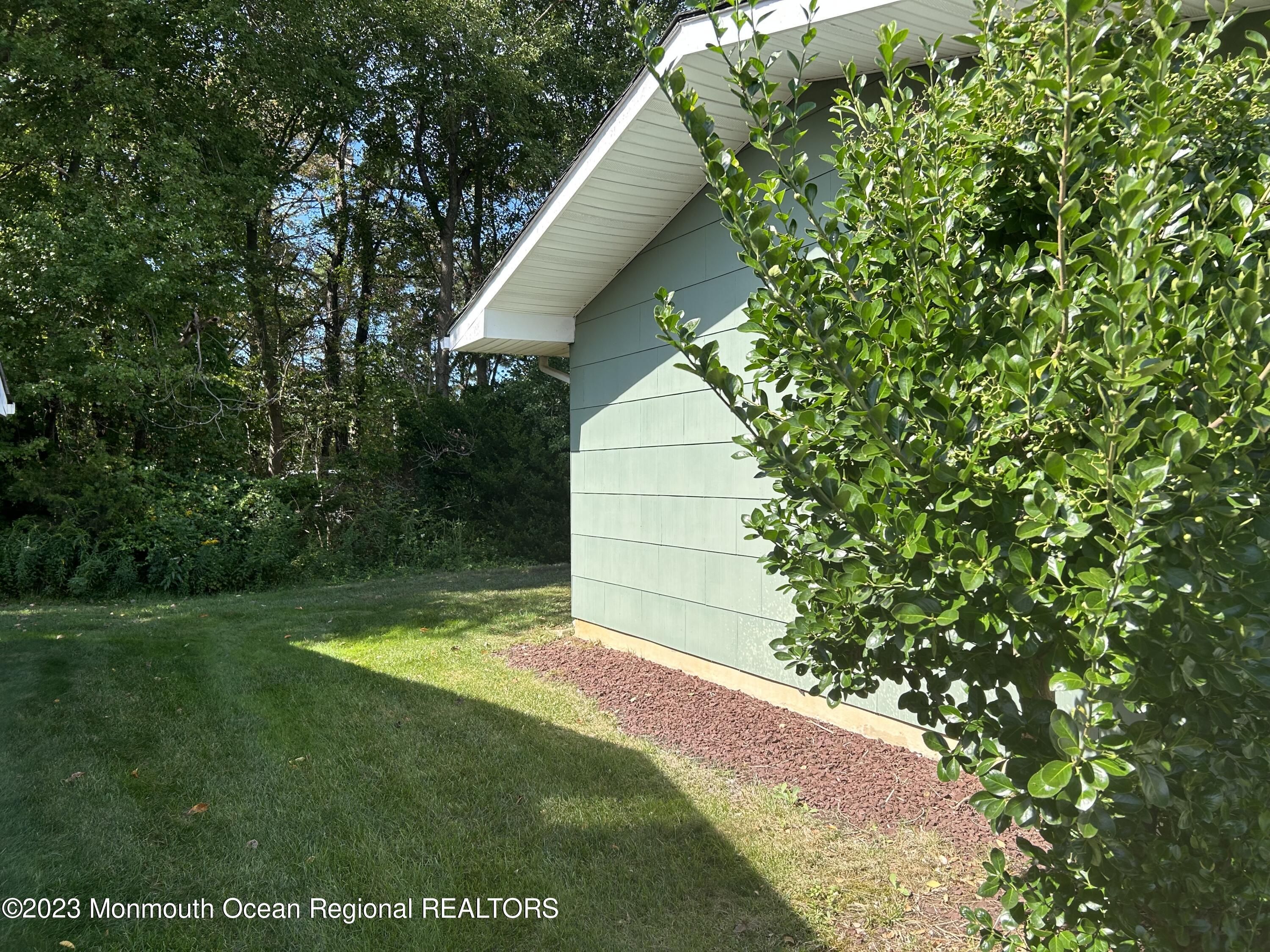51 Markham Road Brick, NJ 08724 - Photo 19 of 31 a view of a backyard with a garden