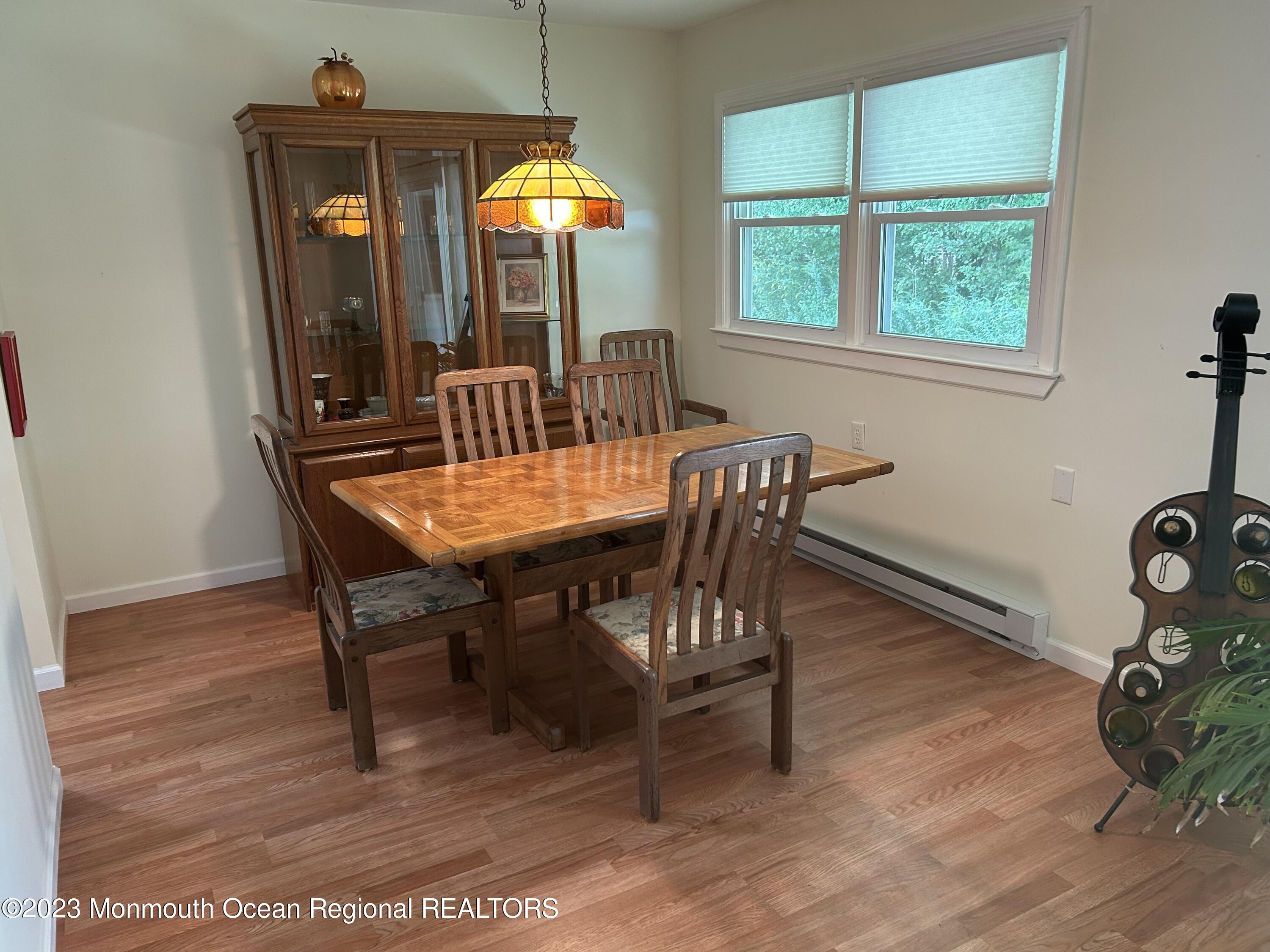 a view of a dining room with furniture and window