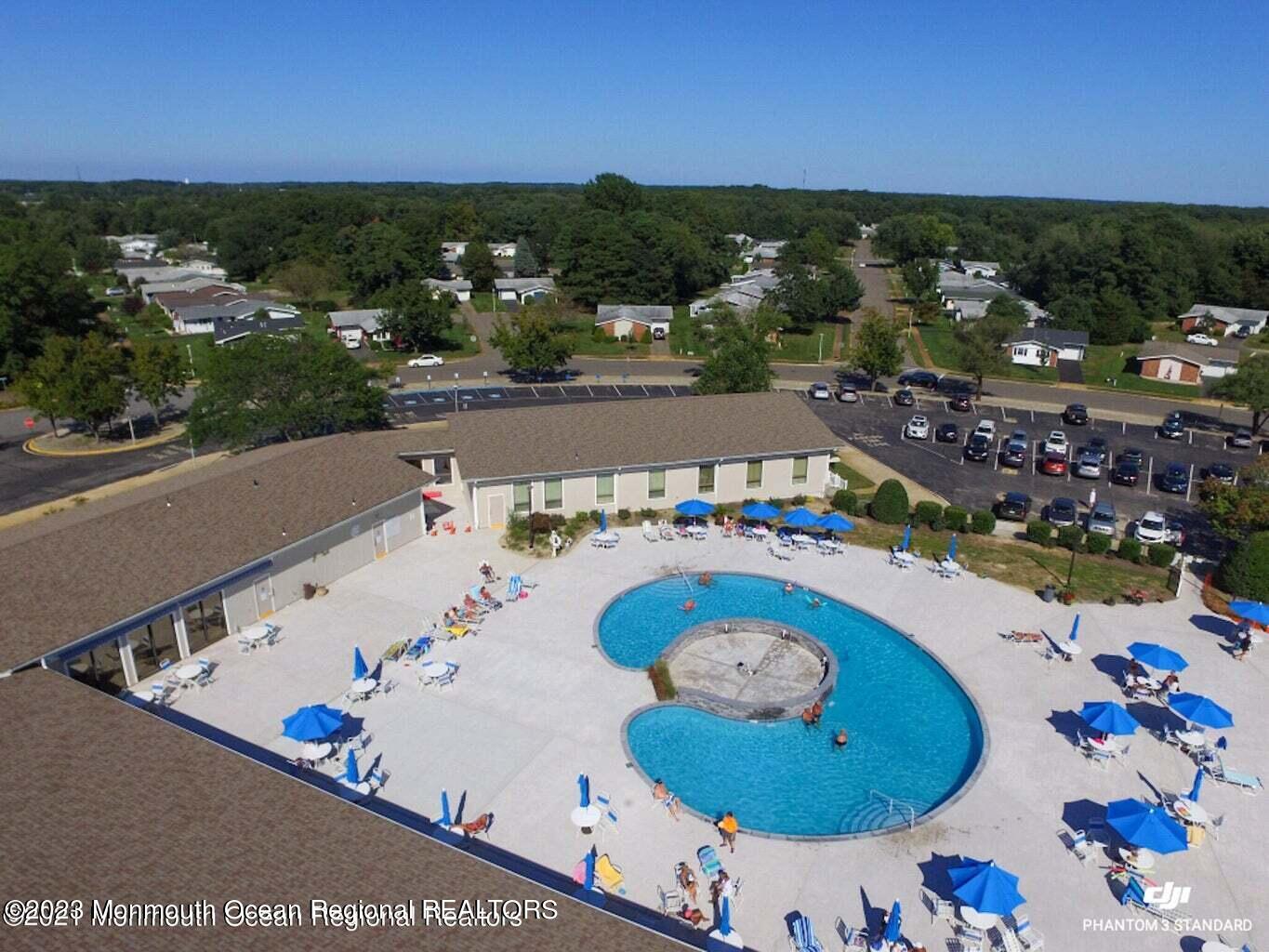 51 Markham Road Brick, NJ 08724 - Photo 24 of 31 an aerial view of a swimming pool patio and outdoor seating