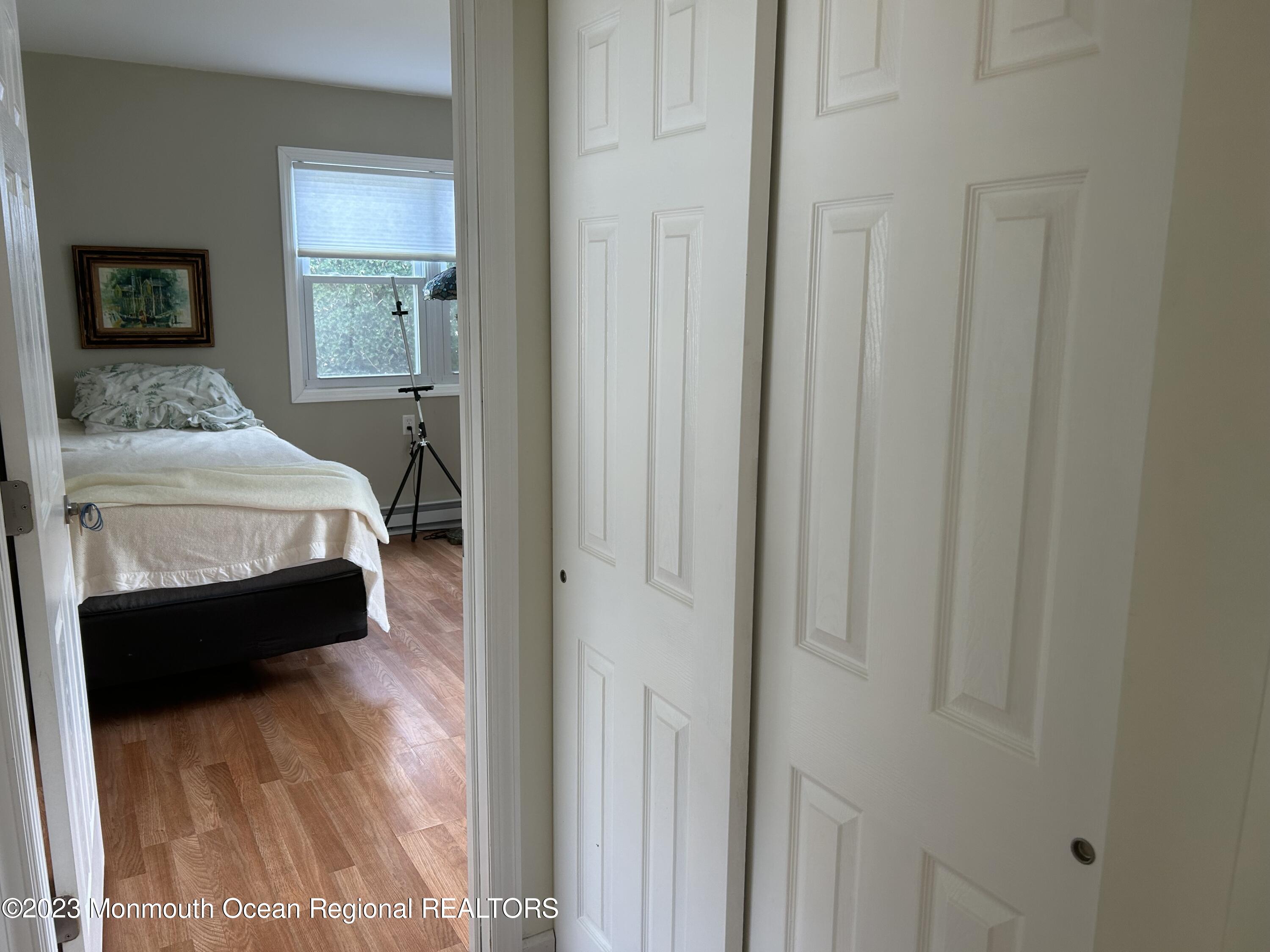 51 Markham Road Brick, NJ 08724 - Photo 27 of 31 a bedroom with a bed and a mirror