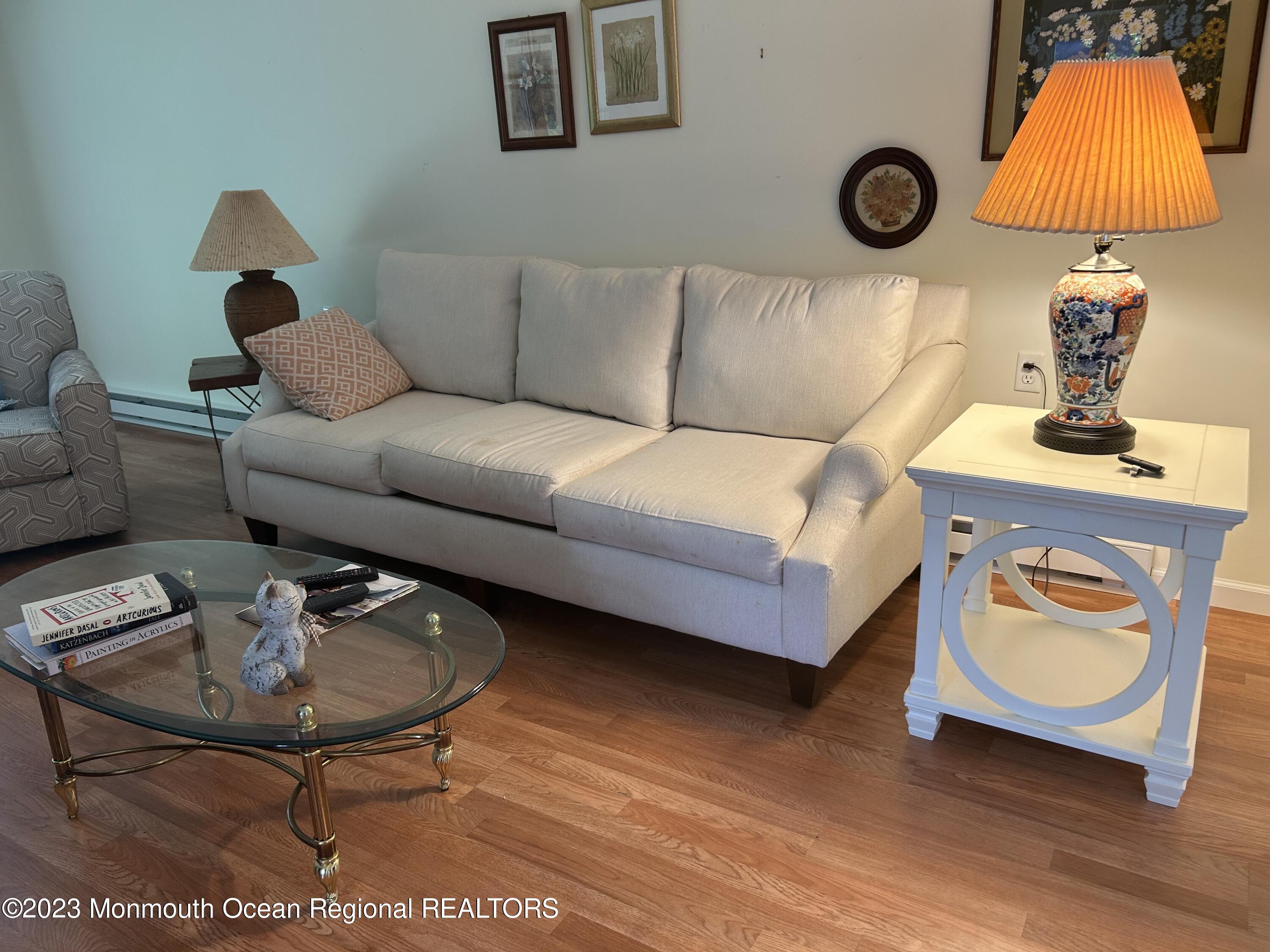 51 Markham Road Brick, NJ 08724 - Photo 3 of 31 a living room with furniture and a lamp