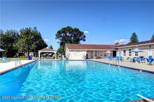 51 Markham Road Brick, NJ 08724 - Photo 4 of 31 a swimming pool view with a outdoor space