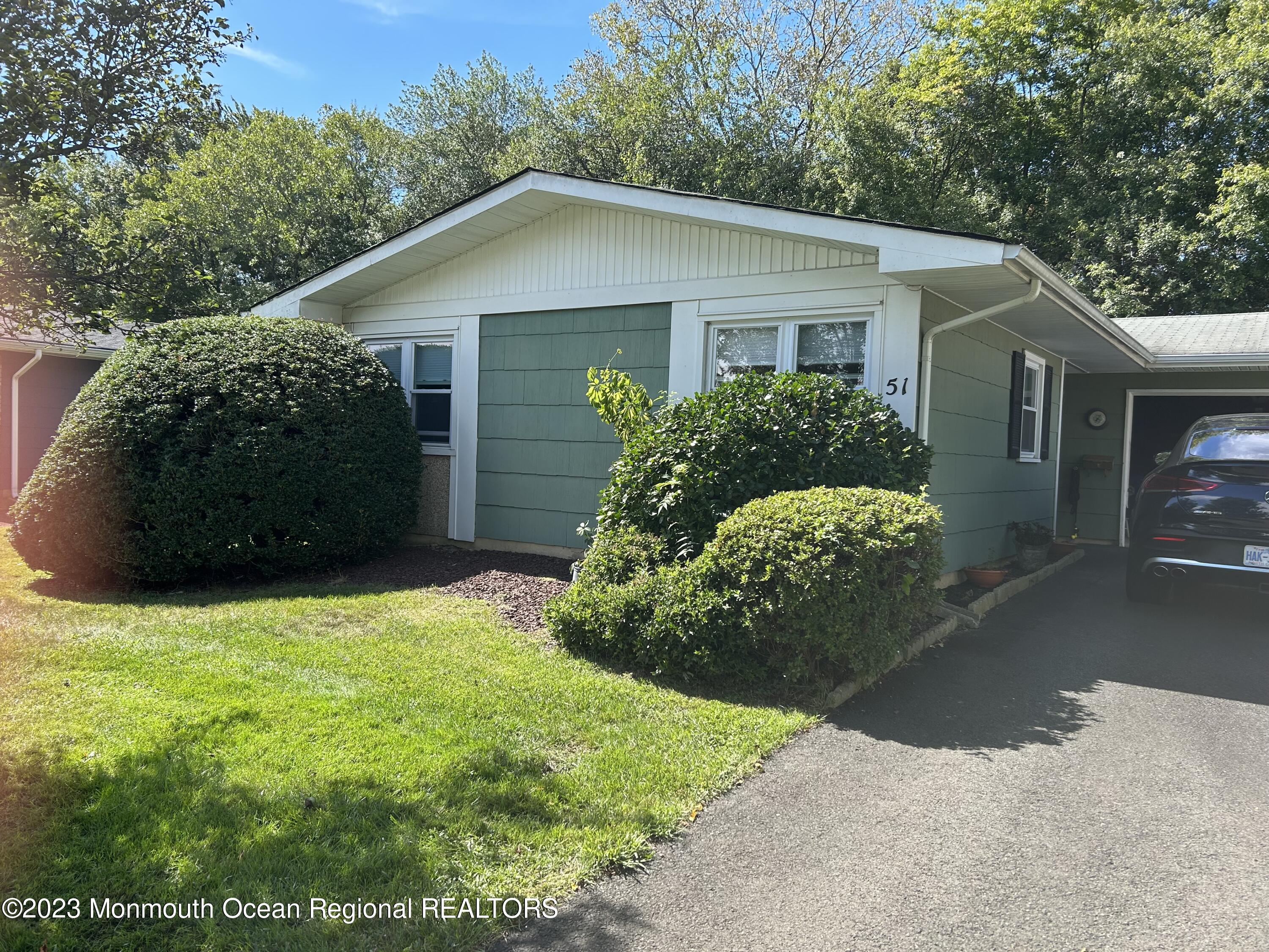 51 Markham Road Brick, NJ 08724 - Photo 5 of 31 a front view of a house with garden