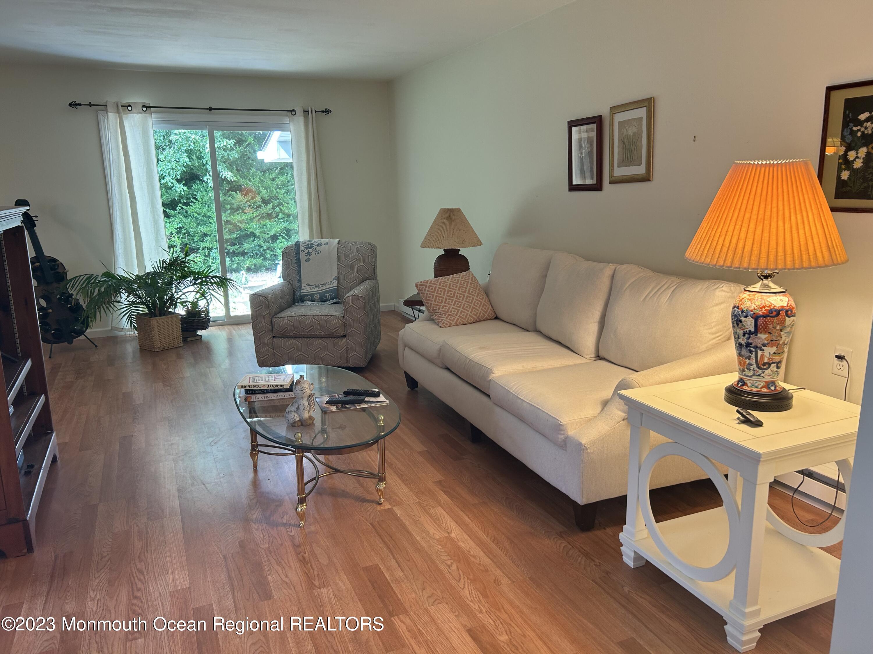 51 Markham Road Brick, NJ 08724 - Photo 7 of 31 a living room with furniture and a flat screen tv