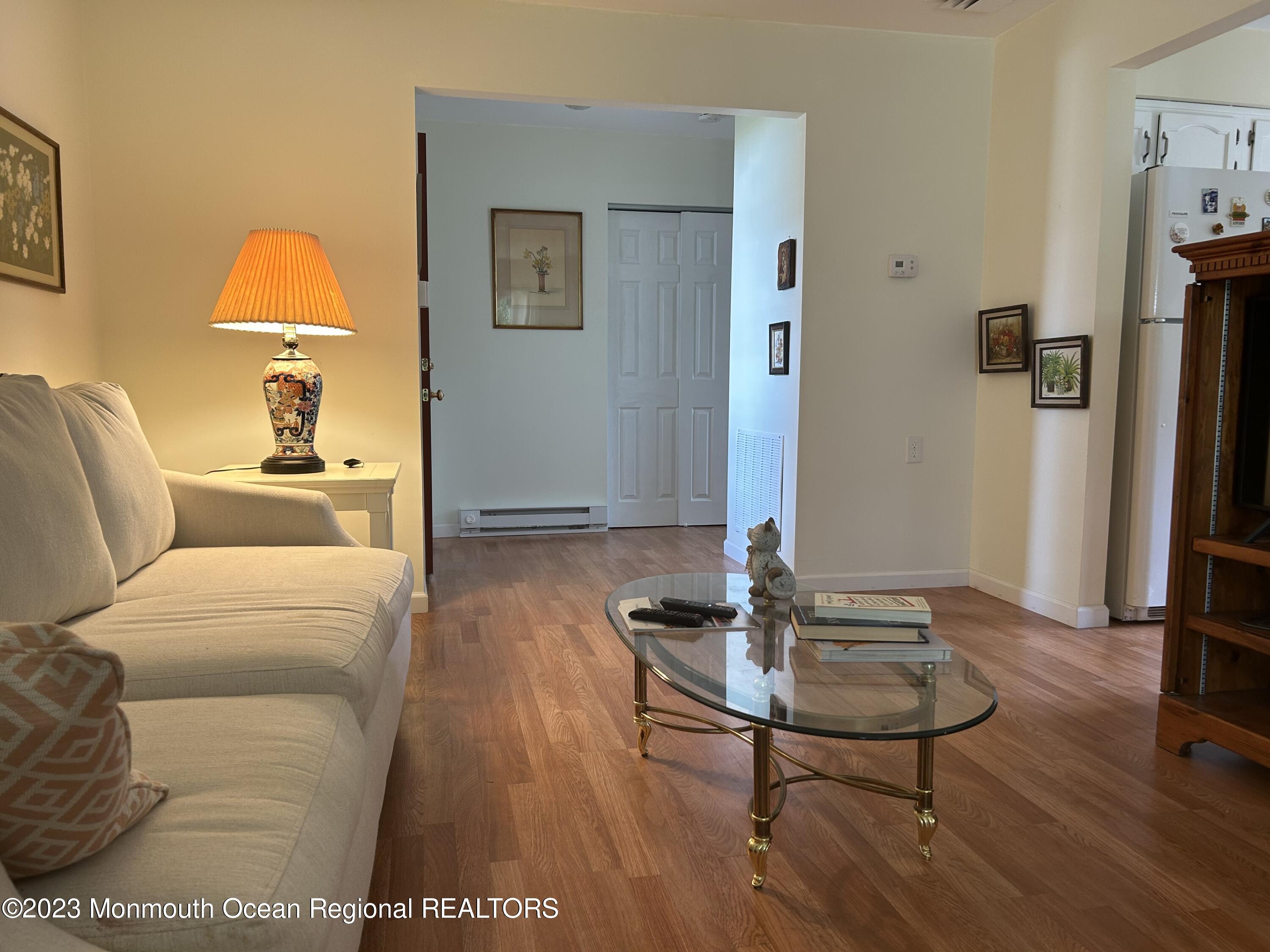 51 Markham Road Brick, NJ 08724 - Photo 8 of 31 a living room with furniture and a wooden floor