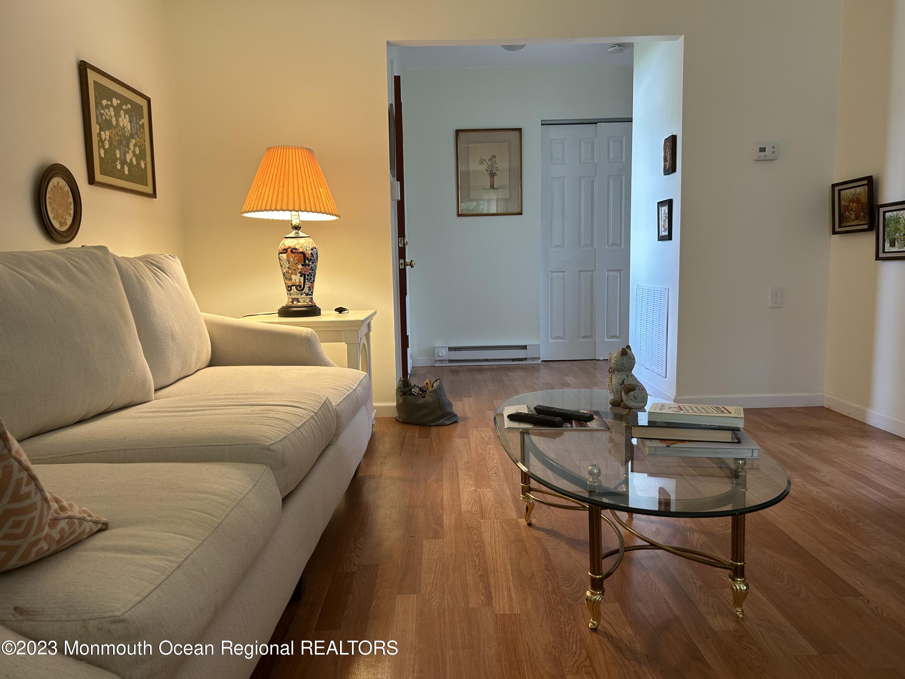 51 Markham Road Brick, NJ 08724 - Photo 10 of 31 a living room with furniture and a table