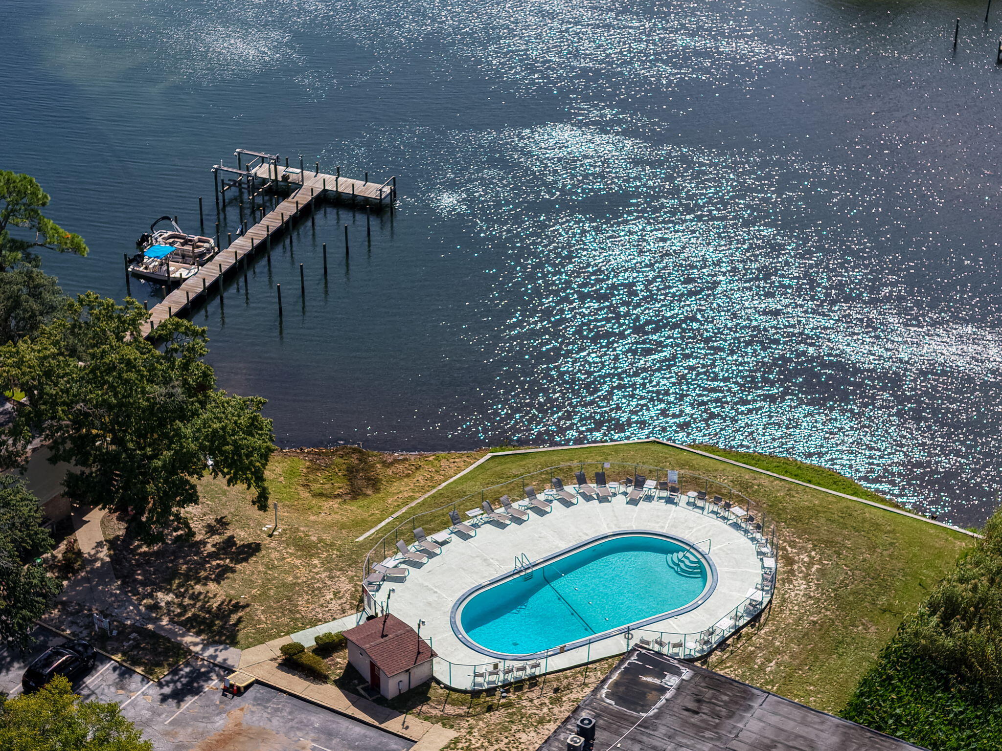 a view of a swimming pool with outdoor seating