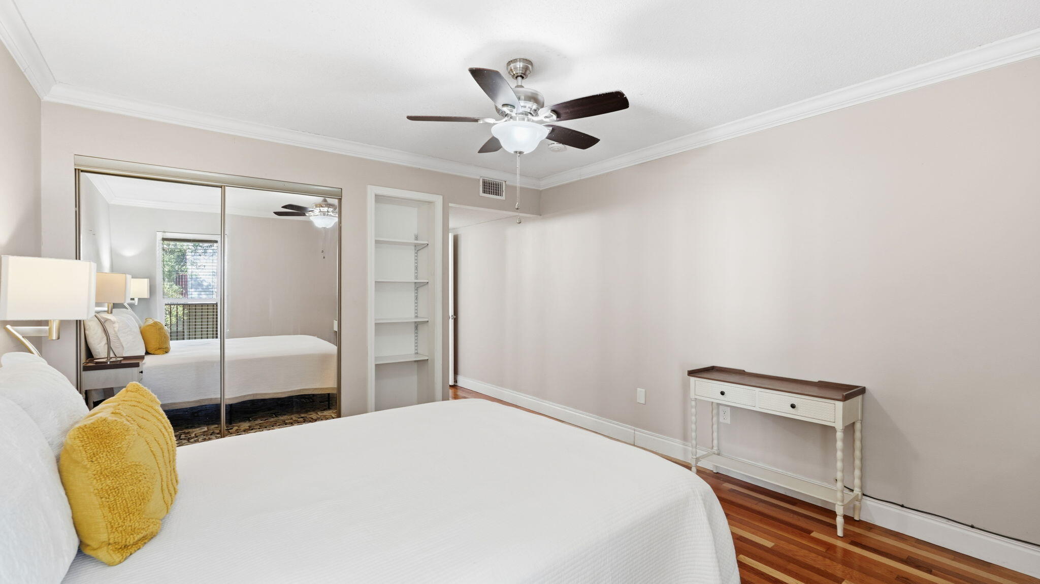 210 Pelham Road, Unit 215A Fort Walton Beach, FL 32547 - Photo 11 of 27 a bedroom with a bed and a chandelier