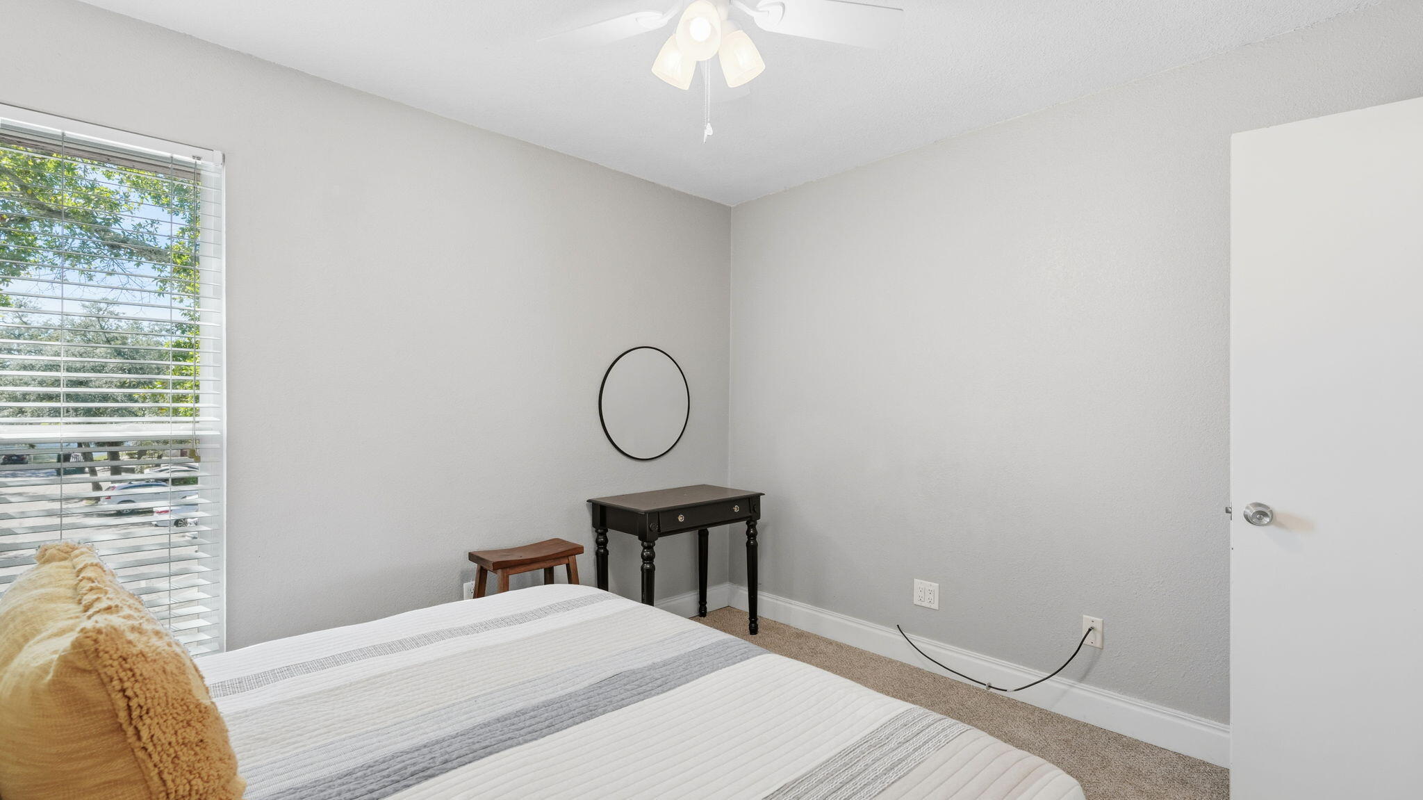 210 Pelham Road, Unit 215A Fort Walton Beach, FL 32547 - Photo 13 of 27 a bedroom with a bed and a chandelier