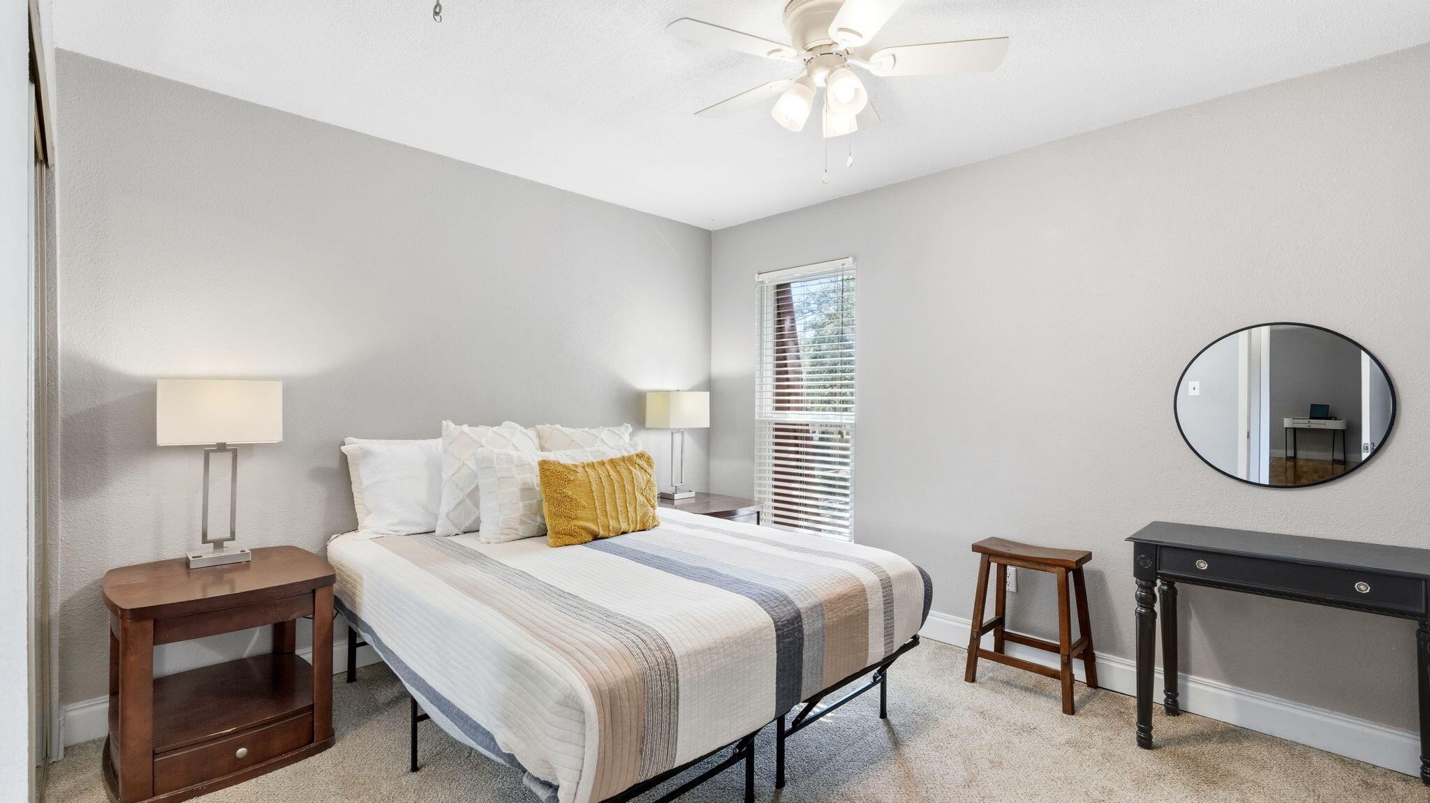 210 Pelham Road, Unit 215A Fort Walton Beach, FL 32547 - Photo 15 of 27 a bedroom with a bed a desk and chair