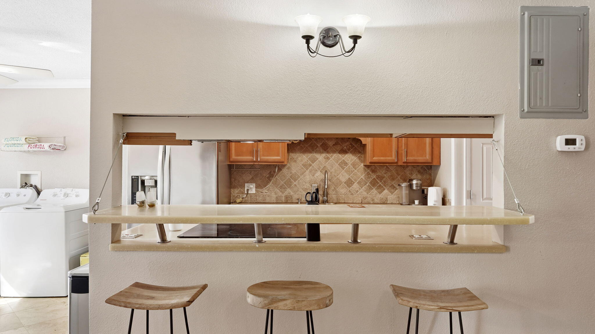 210 Pelham Road, Unit 215A Fort Walton Beach, FL 32547 - Photo 18 of 27 a kitchen with a table and chairs