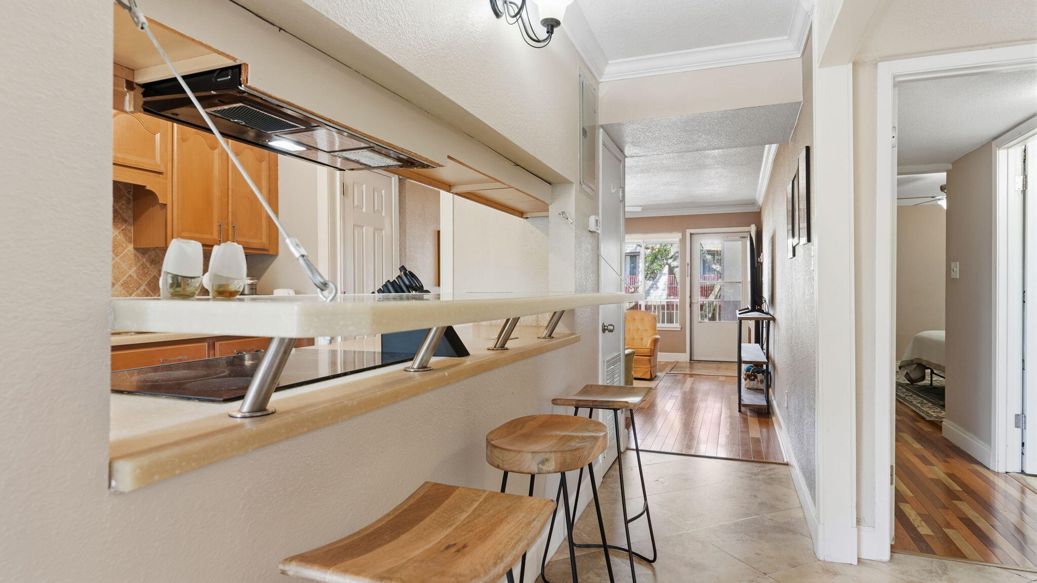 210 Pelham Road, Unit 215A Fort Walton Beach, FL 32547 - Photo 19 of 27 a hallway with a view of living room