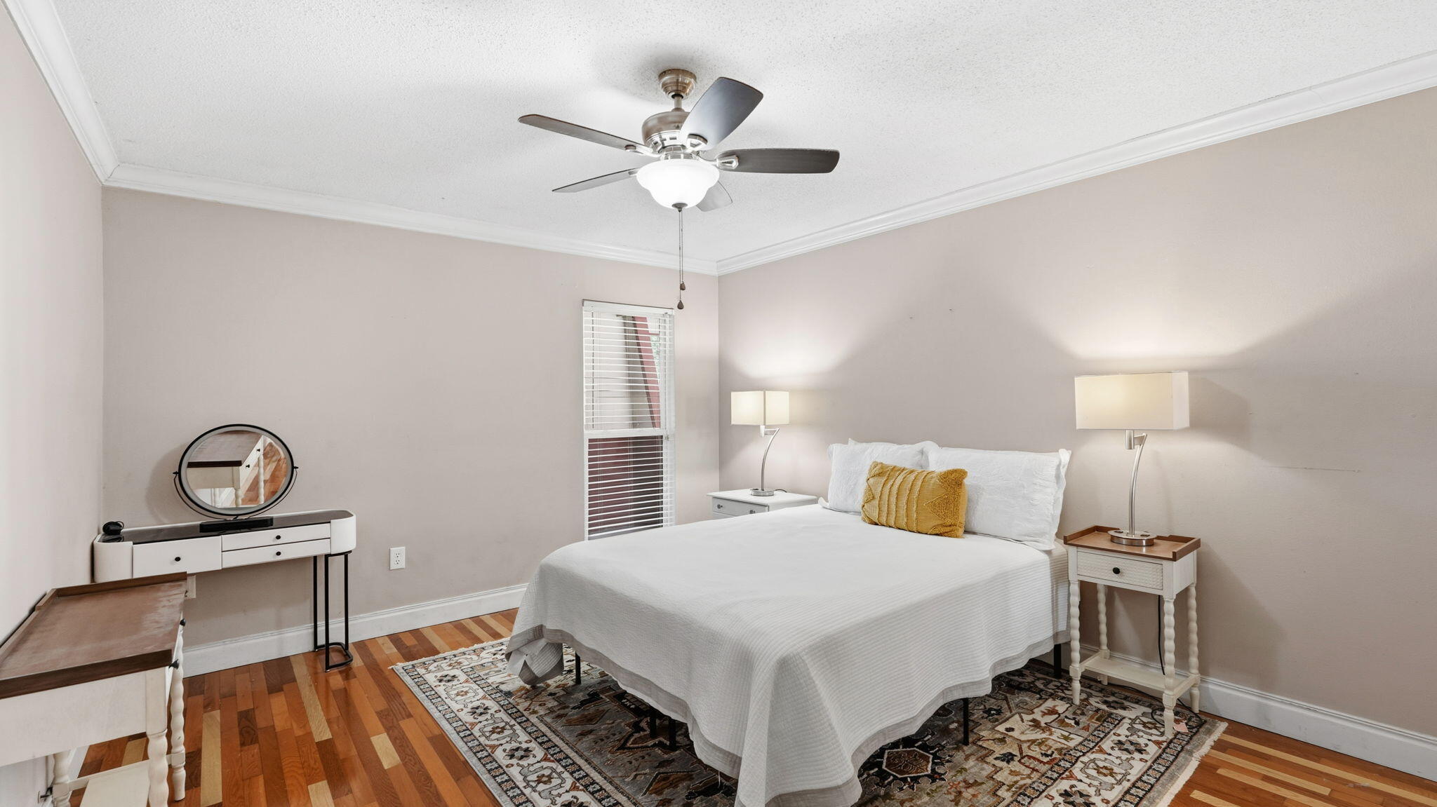 210 Pelham Road, Unit 215A Fort Walton Beach, FL 32547 - Photo 8 of 27 a bedroom with a bed and a chandelier