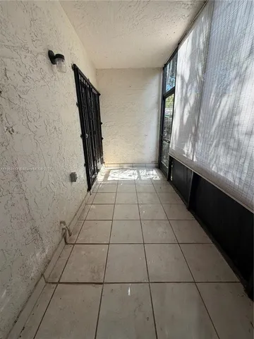 a view of an empty room and entrance