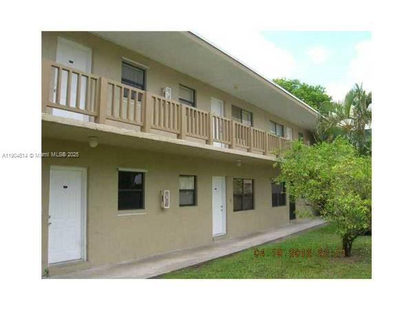 10370 Southwest 220th Street, Unit 118 Cutler Bay, FL 33190 - Photo 14 of 15 a view of a yard in front of house