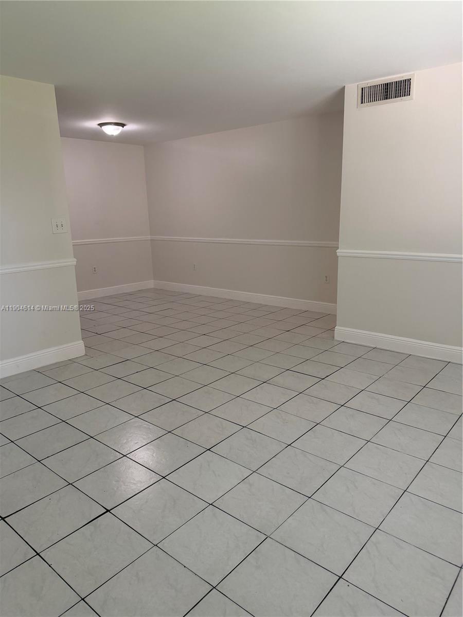 10370 Southwest 220th Street, Unit 118 Cutler Bay, FL 33190 - Photo 3 of 15 a view of empty room