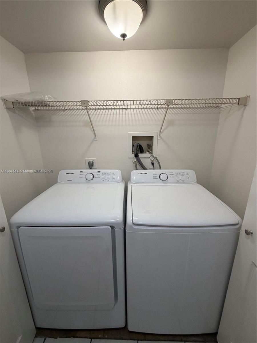 10370 Southwest 220th Street, Unit 118 Cutler Bay, FL 33190 - Photo 7 of 15 a utility room with dryer and washer