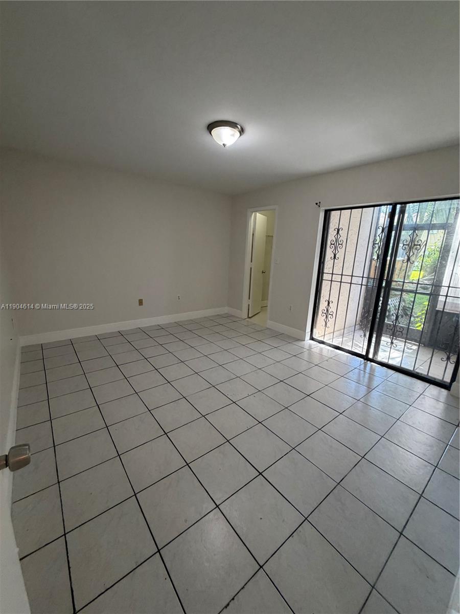 10370 Southwest 220th Street, Unit 118 Cutler Bay, FL 33190 - Photo 9 of 15 a view of an empty room and staircase